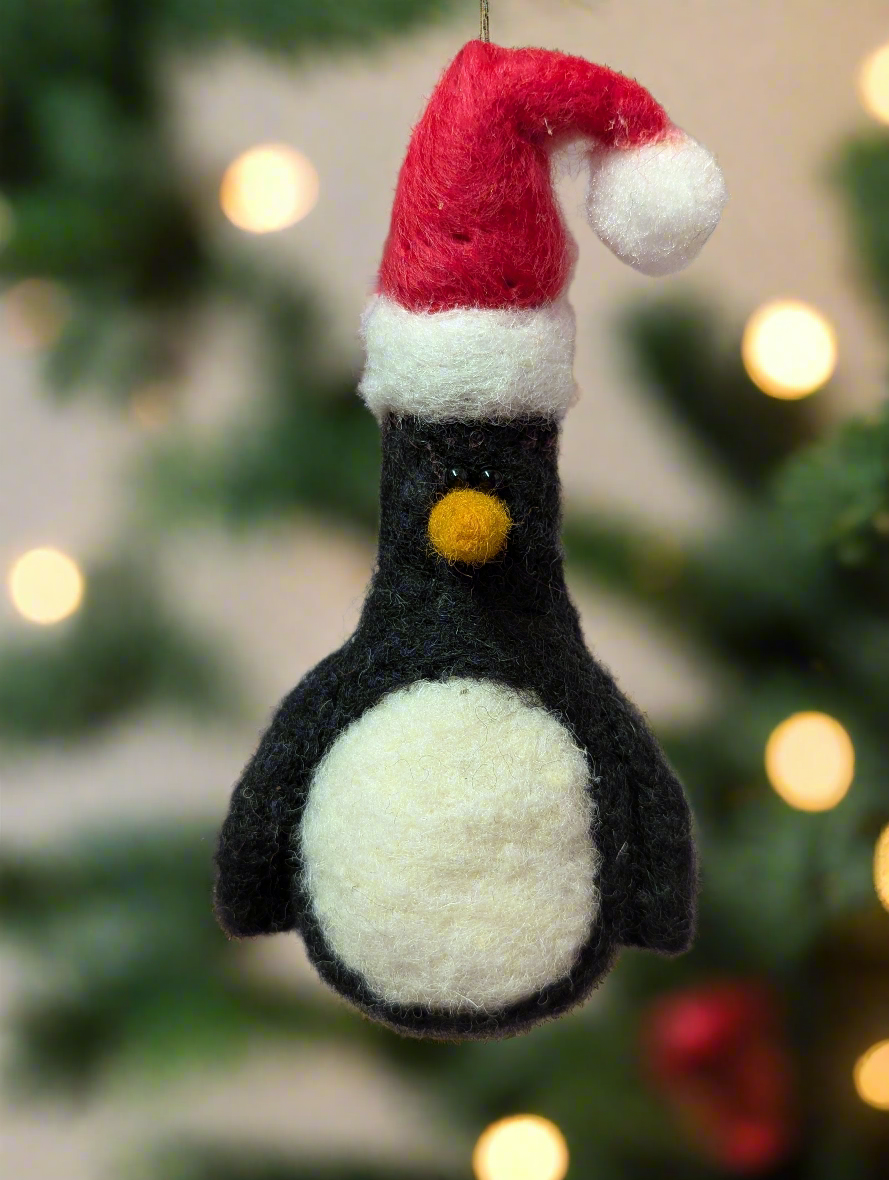 Penguin in a Christmas hat tree decoration